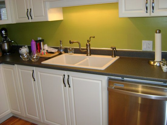 a kitchen with a sink and a dishwasher