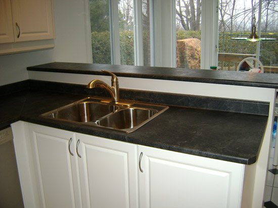 a kitchen with a sink and a window